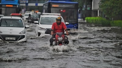 Commuters step out during morning rain , at Delhi's ITO, on Tuesday, August 20, 2024. (Photo by Raj j K Raj / Hindustan Times) Commuters step out during morning rain , at Delhi's ITO, on Tuesday, August 20, 2024. (Photo by Raj j K Raj / Hindustan Times)