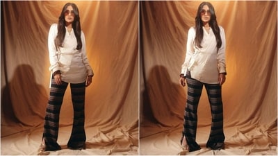 Assisted by celebrity fashion stylist Ami Patel, Karisma styled her look with hoop earrings, a multi-layered necklace, rudraksh bracelets, oversized brown-tinted sunglasses, and a pair of golden high heels. (Instagram/@therealkarismakapoor) Assisted by celebrity fashion stylist Ami Patel, Karisma styled her look with hoop earrings, a multi-layered necklace, rudraksh bracelets, oversized brown-tinted sunglasses, and a pair of golden high heels. (Instagram/@therealkarismakapoor)