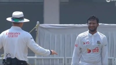The umpire reprimands Shakib Al Hasan after he throws the ball towards Mohammad Rizwan (X) The umpire reprimands Shakib Al Hasan after he throws the ball towards Mohammad Rizwan (X)