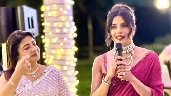 In one picture from inside the event, Priyanka was seen addressing the family and friends, speaking with a microphone in hand. Her mother, Madhu Chopra, was seen standing beside.