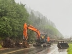 A worker clears debris after a deadly landslide in Ketchikan, Alaska, Sunday, Aug. 25, 2024. (Anna Laffrey/Ketchikan Daily News via AP)