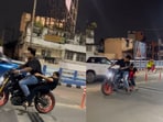 The woman fell of the bike after the stunt was performed. The woman fell of the bike after the stunt was performed.