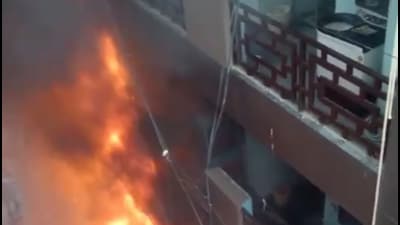 As the fire started on the ground floor, people residing in the paying guest facilities did not have a way to escape and they quickly climbed to the terrace, they were later rescued using a ladder. (HT Photo) As the fire started on the ground floor, people residing in the paying guest facilities did not have a way to escape and they quickly climbed to the terrace, they were later rescued using a ladder. (HT Photo)