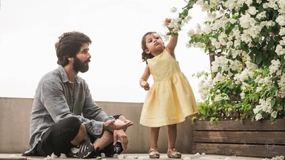 This picture of Shahid being a doting father as his daughter collects flowers and places them in his palms is also quite adorable. This picture of Shahid being a doting father as his daughter collects flowers and places them in his palms is also quite adorable.