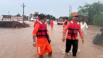 NDRF in Gujarat carries out rescue operation of those stranded due to rains (Twitter Photo) NDRF in Gujarat carries out rescue operation of those stranded due to rains (Twitter Photo)