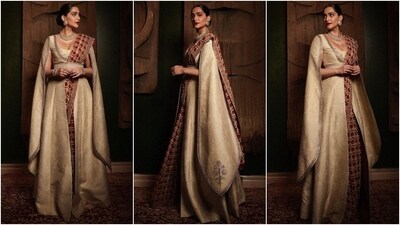 Here, Sonam styled her red floral print ivory georgette saree with a raw silk cream-coloured jacket featuring calf-length slit sleeves, a plunging neckline, and a front slit. The floor-length coat acted as the blouse for the saree, and Sonam cinched everything with an embroidered kamarbandh. (Instagram) Here, Sonam styled her red floral print ivory georgette saree with a raw silk cream-coloured jacket featuring calf-length slit sleeves, a plunging neckline, and a front slit. The floor-length coat acted as the blouse for the saree, and Sonam cinched everything with an embroidered kamarbandh. (Instagram)