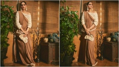 The brown saree custom-designed by mom-to-be Masaba Gupta's label, House of Masaba, was styled by Sonam's sister Rhea Kapoor and her team. Meanwhile, the stylish blouse is by South Korean fashion designer Rejina Pyo's eponymous label. (Instagram) The brown saree custom-designed by mom-to-be Masaba Gupta's label, House of Masaba, was styled by Sonam's sister Rhea Kapoor and her team. Meanwhile, the stylish blouse is by South Korean fashion designer Rejina Pyo's eponymous label. (Instagram)