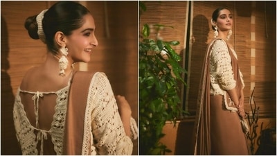 Sonam chose crochet accessories to style the saree, including dangling flower earrings, a scrunchie, and a mini clutch. She also wore a statement opal ring and embroidered brown loafers. Lastly, centre-parted bun, kohl-lined eyes, rouge-tinted cheeks, nude lip shade, feathered brows, shimmering brown eye shadow, and mascara-adorned lashes completed the glam. (Instagram) Sonam chose crochet accessories to style the saree, including dangling flower earrings, a scrunchie, and a mini clutch. She also wore a statement opal ring and embroidered brown loafers. Lastly, centre-parted bun, kohl-lined eyes, rouge-tinted cheeks, nude lip shade, feathered brows, shimmering brown eye shadow, and mascara-adorned lashes completed the glam. (Instagram)