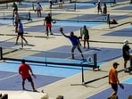 People practice pickleball on the courts of CityPickle at Central Park's Wollman Rink, Saturday, Aug. 24, 2024, in New York. (AP Photo/Eduardo Munoz Alvarez)