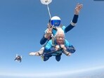 The image shows Manette Baillie, a 102-year-old UK woman who skydived. The image shows Manette Baillie, a 102-year-old UK woman who skydived.