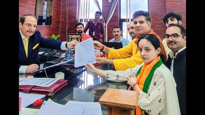 BJP candidate from Kishtwar Shagun Parihar accompanied by party state president Ravinder Raina files her nomination papers for the Jammu and Kashmir assembly elections in Kishtwar on Tuesday. (ANI)