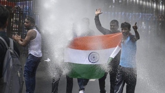 Police use water cannon in Nabanna March by Paschimbanga Chhatrasamaz at Howrah bridge in Kolkata on August 27. (HT Photo/Samir Jana)