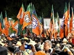 BJP supporters with party flags. (ANI) BJP supporters with party flags. (ANI)