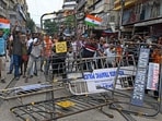 Activists wrecking barricades set up by the police during a rally on Tuesday (AFP) Activists wrecking barricades set up by the police during a rally on Tuesday (AFP)