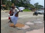 Karnataka men dress up as Yamaraja and Chitragupta to protest against potholes in Udupi, conduct long-jump race. Video Karnataka men dress up as Yamaraja and Chitragupta to protest against potholes in Udupi, conduct long-jump race. Video