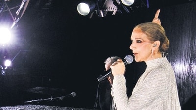 A grab of a video released by the Olympic Broadcasting Services shows Canadian Singer Celine Dion performing on the Eiffel Tower during the opening ceremony of the Paris 2024 Olympic Games, in Paris, on July 26, 2024. (Photo by various sources / AFP) / RESTRICTED TO EDITORIAL USE - MANDATORY CREDIT "POOL / OLYMPIC BROADCASTING SERVICES " - NO MARKETING NO ADVERTISING CAMPAIGNS - DISTRIBUTED AS A SERVICE TO CLIENTS (AFP) A grab of a video released by the Olympic Broadcasting Services shows Canadian Singer Celine Dion performing on the Eiffel Tower during the opening ceremony of the Paris 2024 Olympic Games, in Paris, on July 26, 2024. (Photo by various sources / AFP) / RESTRICTED TO EDITORIAL USE - MANDATORY CREDIT "POOL / OLYMPIC BROADCASTING SERVICES " - NO MARKETING NO ADVERTISING CAMPAIGNS - DISTRIBUTED AS A SERVICE TO CLIENTS (AFP)