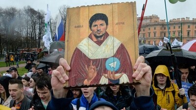 Demonstrators with a icon stylised painting depicting Telegram's founder Pavel Durov  protest against the blocking of the popular messaging app in Russia. (AFP)