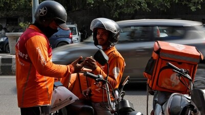 Gig workers prepare to deliver orders outside Swiggy's grocery warehouse at a market area in New Delhi, India, May 6, 2024. (Priyanshu Singh/Reuters) Gig workers prepare to deliver orders outside Swiggy's grocery warehouse at a market area in New Delhi, India, May 6, 2024. (Priyanshu Singh/Reuters)