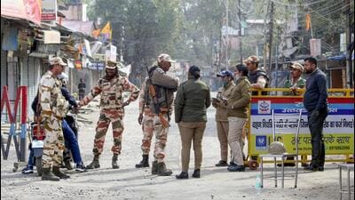 ITBP and Uttarakhand Police personnel stand guard on a road on February 12, 2024, during a curfew in Haldwani’s Banbhoolpura area following incidents of violence. (PTI File Photo) ITBP and Uttarakhand Police personnel stand guard on a road on February 12, 2024, during a curfew in Haldwani’s Banbhoolpura area following incidents of violence. (PTI File Photo)