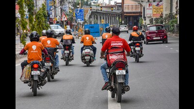 New Delhi: In this Tuesday, March 31, 2020 file photo, deliverymen of food aggregators Swiggy and Zomato ride their bikes towards their destinations, in New Delhi. (PTI Photo) (PTI) New Delhi: In this Tuesday, March 31, 2020 file photo, deliverymen of food aggregators Swiggy and Zomato ride their bikes towards their destinations, in New Delhi. (PTI Photo) (PTI)