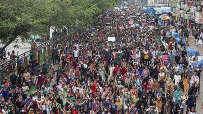People participate in a protest march against Prime Minister Sheikh Hasina and her government to demand justice for the victims killed in the recent countrywide deadly clashes, in Dhaka, Bangladesh, on August 3. (AP) People participate in a protest march against Prime Minister Sheikh Hasina and her government to demand justice for the victims killed in the recent countrywide deadly clashes, in Dhaka, Bangladesh, on August 3. (AP)