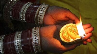 Someone had told someone that someone had met a woman who ordered the people of Pune to celebrate Diwali on “Shravan Amamasya”. The woman wore a lock in one ear and a lamp in the other. (REPRESENTATIVE PHOTO) Someone had told someone that someone had met a woman who ordered the people of Pune to celebrate Diwali on “Shravan Amamasya”. The woman wore a lock in one ear and a lamp in the other. (REPRESENTATIVE PHOTO)
