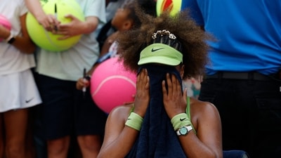 Naomi Osaka (JPN) reacts in her player's chair after her match against Jelena Ostapenko (LAT)(not pictured) in a women's singles match on day two of the 2024 U.S. Open tennis tournament (USA TODAY Sports via Reuters Con)