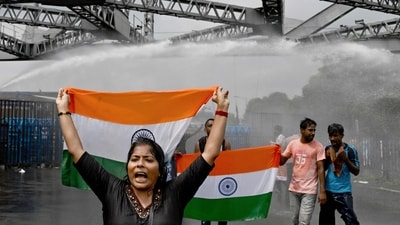 Police use water canons to disperse protesters carrying national flag as they march towards the state secretariat demanding the resignation of West Bengal chief minister Mamata Banerjee amid protests against the rape and murder of a doctor. (AFP) Police use water canons to disperse protesters carrying national flag as they march towards the state secretariat demanding the resignation of West Bengal chief minister Mamata Banerjee amid protests against the rape and murder of a doctor. (AFP)