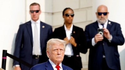 Donald Trump looks on during a wreath laying ceremony at the Tomb of the Unknown Soldier at Arlington National Cemetery on August 26, 2024 in Arlington, Virginia. Monday marks three years since the August 26, 2021, (Getty Images via AFP) Donald Trump looks on during a wreath laying ceremony at the Tomb of the Unknown Soldier at Arlington National Cemetery on August 26, 2024 in Arlington, Virginia. Monday marks three years since the August 26, 2021, (Getty Images via AFP)