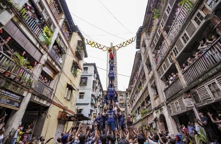 A five-layer human pyramid tries to break the handi (Photo: PTI) A five-layer human pyramid tries to break the handi (Photo: PTI)