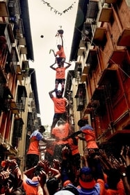 Showers of curd burst out as govindas break the handi (Photo: PTI) Showers of curd burst out as govindas break the handi (Photo: PTI)