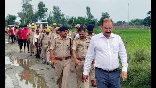 DM VK Singh and SP Alok Priyadarshi reach the site after two girls allegedly committed suicide in Bhagautipur village in Farrukhabad on Wednesday. (ANI Photo)