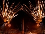 General view of the torch relay performance as the Obelisk of Luxor on the Place de la Concorde is seen during the opening ceremony