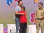 Salman Khan with a young fan at Mumbai event. Salman Khan with a young fan at Mumbai event.