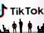 Small toy figures are seen in front of TikTok logo in this illustration picture taken March 15, 2021. (Dado Ruvic/Reuters)
