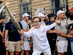 Jackie Chan carries Paralympic torch in Paris