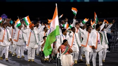 Flagbearers Bhagyashri Mahavrao Jadhav of India and Sumit of India lead their contingent during the Opening Ceremony for the 2024 Paralympics. (AP) Flagbearers Bhagyashri Mahavrao Jadhav of India and Sumit of India lead their contingent during the Opening Ceremony for the 2024 Paralympics. (AP)