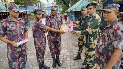 Border Security Force and Border Guard of Bangladesh officials exchange greetings on India's Independence Day in Dakshin Dinajpur district. (PTI Photo) Border Security Force and Border Guard of Bangladesh officials exchange greetings on India's Independence Day in Dakshin Dinajpur district. (PTI Photo)