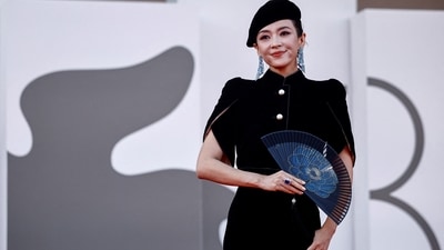 The 81st Venice Film Festival Jury member Zhang Ziyi attended the Beetlejuice screening in an Armani Privé Fall 2024 velvet ensemble. The luxurious fabric and precise tailoring of the jumpsuit exude elegance and sophistication. She accessorised with a patterned hand-held fan, a beret, statement jewels, and striking glam.&nbsp; (REUTERS)