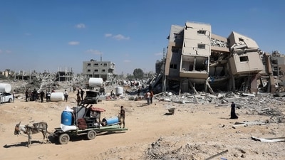 Palestinians who retuned briefly to eastern Deir al-Balah in the central Gaza Strip to check on property, carry away some items they were able to salvage amid the devastation, after Israeli troops pulled out from some blocks in the area on August 29, 2024, amid the ongoing conflict between Israel and the Hamas militant group. (AFP) Palestinians who retuned briefly to eastern Deir al-Balah in the central Gaza Strip to check on property, carry away some items they were able to salvage amid the devastation, after Israeli troops pulled out from some blocks in the area on August 29, 2024, amid the ongoing conflict between Israel and the Hamas militant group. (AFP)