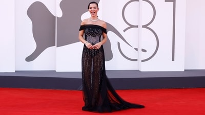 Amy Jackson attended Day 1 of the Venice Film Festival in an Alberta Ferretti gown. She chose an off-shoulder dress featuring a tulle wrap around the bust, shimmering diamantes on the front, a corset bodice, and a see-through skirt. She wore the ensemble with diamond jewels, a sleek hairdo, and minimal glam. (Vianney Le Caer/Invision/AP) Amy Jackson attended Day 1 of the Venice Film Festival in an Alberta Ferretti gown. She chose an off-shoulder dress featuring a tulle wrap around the bust, shimmering diamantes on the front, a corset bodice, and a see-through skirt. She wore the ensemble with diamond jewels, a sleek hairdo, and minimal glam. (Vianney Le Caer/Invision/AP)