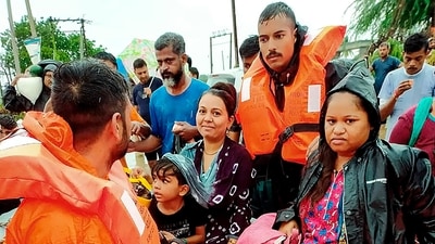 An Indian Navy team conducts a rescue operation in a flood-hit area after heavy rains in Gujarat. (PTI) An Indian Navy team conducts a rescue operation in a flood-hit area after heavy rains in Gujarat. (PTI)