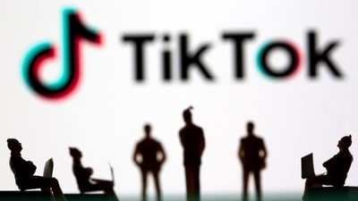 Small toy figures are seen in front of TikTok logo in this illustration picture taken March 15, 2021. (Dado Ruvic/Reuters)
