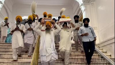 The two holy saroops (physical copies) of Guru Granth Sahib being brought to Gurdwara Baba Gurbakhsh Singh in Amritsar after they were received at the airport on Wednesday night. (HT Photo) The two holy saroops (physical copies) of Guru Granth Sahib being brought to Gurdwara Baba Gurbakhsh Singh in Amritsar after they were received at the airport on Wednesday night. (HT Photo)