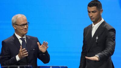 UEFA's Giorgio Marchetti watches Cristiano Ronaldo press a button to proceed with the Champions League draw in Monaco. (AP) UEFA's Giorgio Marchetti watches Cristiano Ronaldo press a button to proceed with the Champions League draw in Monaco. (AP)