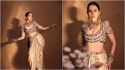 In this last look, Uorfi chose an ensemble hand-embroidered with pearls, emeralds, rubies, and crystals. She wore a chamois satin sarong skirt and an ivory power shoulder blouse. An intricately bejewelled belt completed her opulent look.&nbsp; (Instagram)
