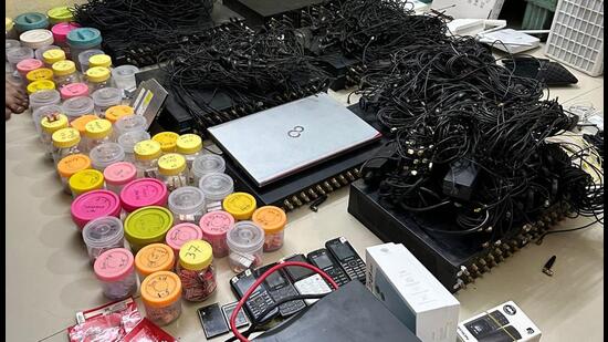 The sleuths raided flat number 305 located on the first floor of MA Complex in Mithanagar in the presence of telecommunication department officials and residents. (HT PHOTO)