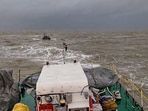 An Indian Coast Guard ship tows boat ‘Padmawati’ to safety after it drifted into the sea due to rough weather conditions off the Dwarka coast in Gujarat. (PTI Photo) An Indian Coast Guard ship tows boat ‘Padmawati’ to safety after it drifted into the sea due to rough weather conditions off the Dwarka coast in Gujarat. (PTI Photo)
