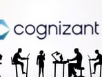 Figurines with computers and smartphones are seen in front of Cognizant logo in this illustration taken, February 19, 2024. (Dado Ruvic/Reuters)