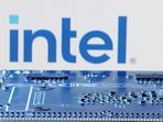 Intel logo is seen near computer motherboard.